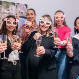 Eight ladies celebrating a bachelorette party / hen party at Atelier Mein Meisterwerk – creative jewelry workshop with prosecco, theme masks and unforgettable memories in Basel.
