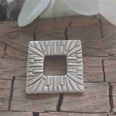 Unique silver pendant handcrafted during a Creative Jewelry Workshop Basel using silver clay and personal design ideas..