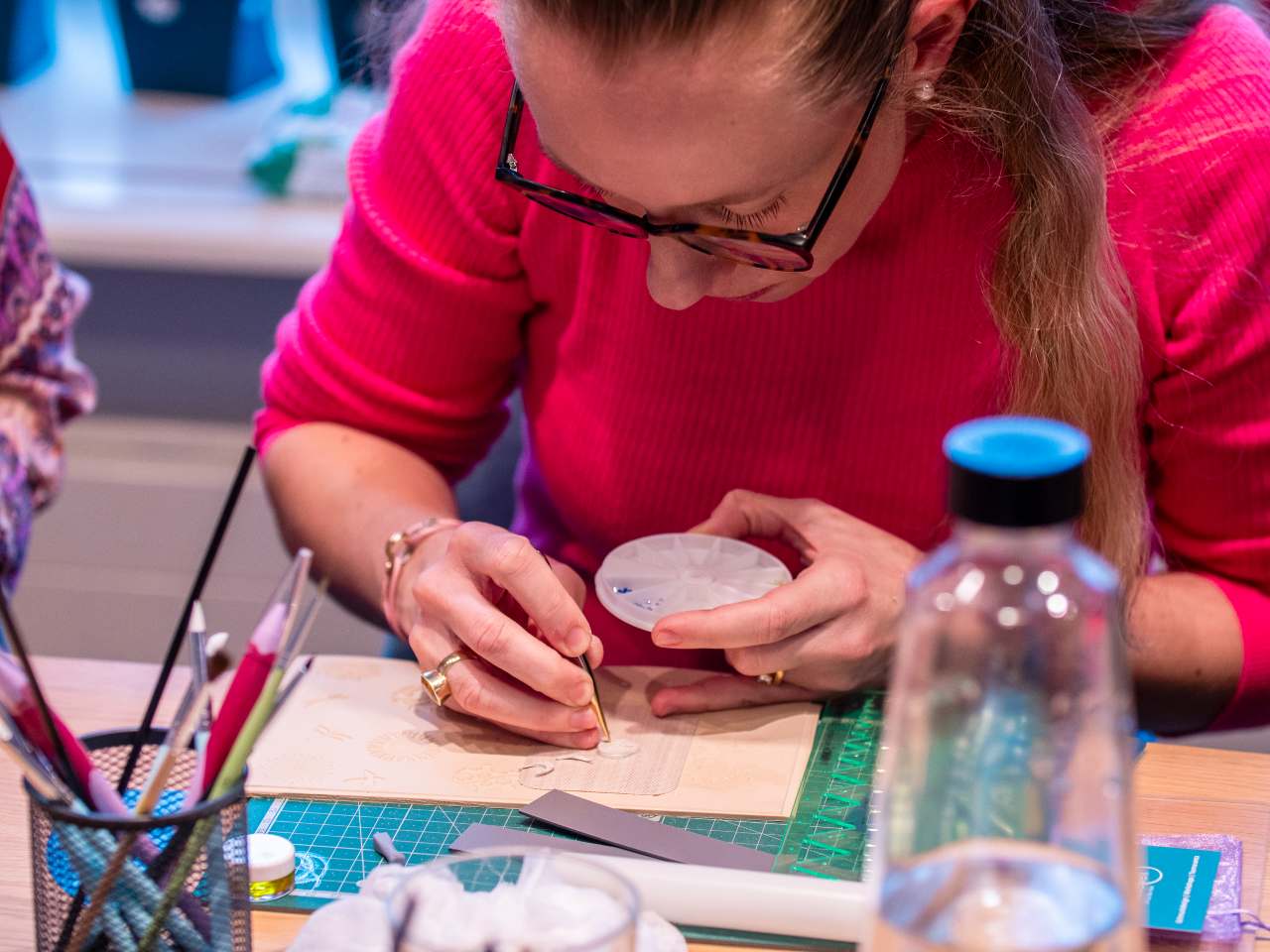 One participant carefully shaping a silver clay jewelry piece during a creative workshop in Basel – inspiring team event and creative group activity.