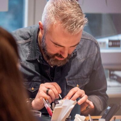 Participant creates unique handmade silver ring during a creative event in Basel
